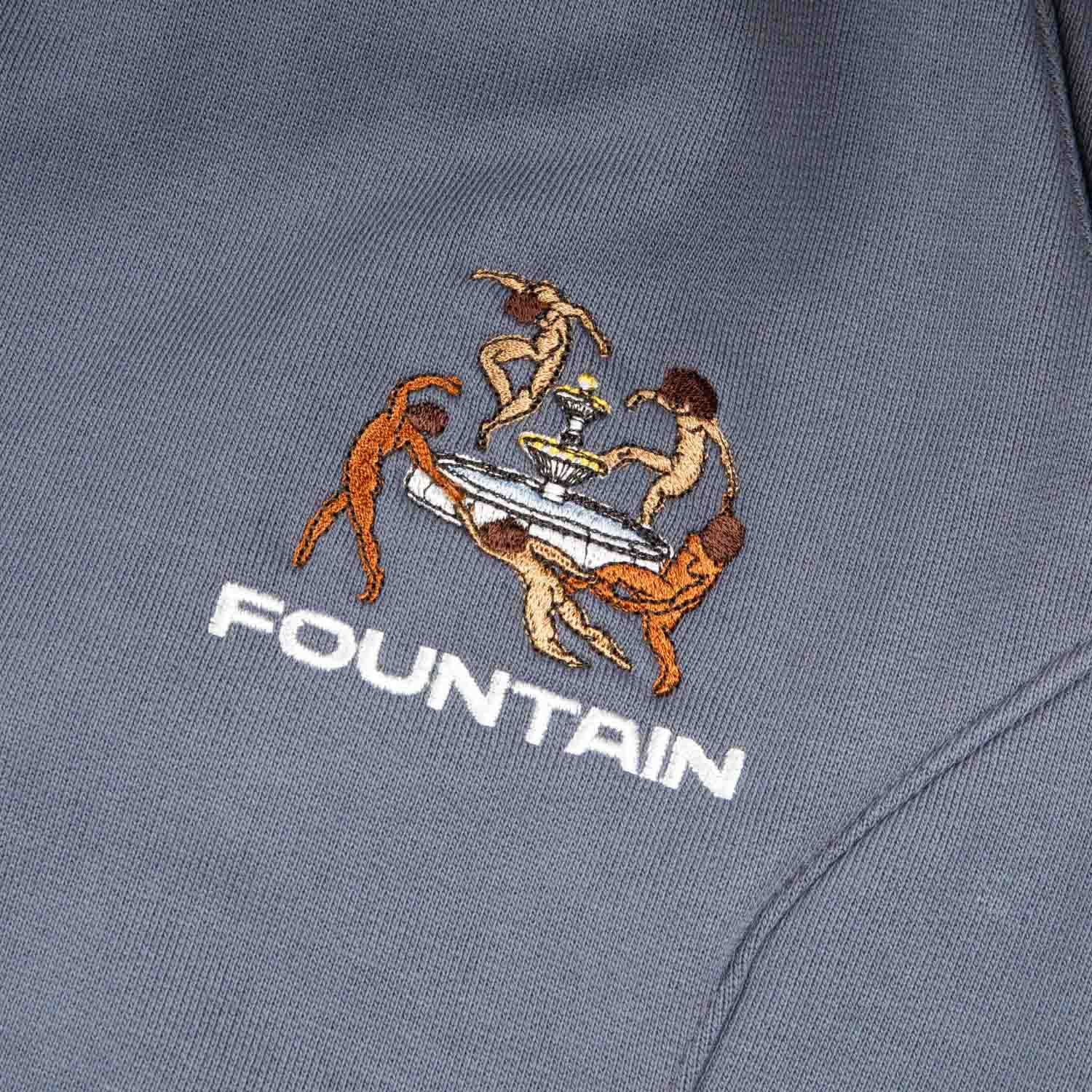 Close detail of the embroidered Liberation artwork at the left pocket