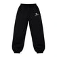 Monogram Joggers in black, front view, laid flat
